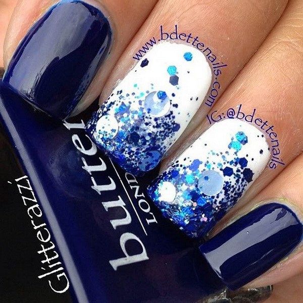 Elegant Nail Design: Striking Navy Blue and White with Sparkling Glitter Gradient.