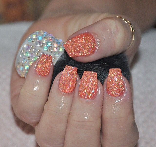 Vibrant Glittery Orange Nails: A Modern Touch for Festive Occasions.