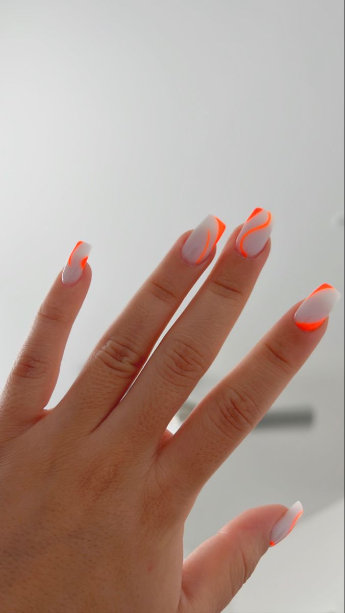 Bold Neon Orange and Sleek White Nail Design: A Playful Statement of Modern Sophistication.