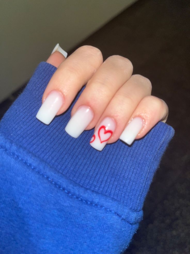 Chic Ombre Square-Tipped Nails with White Tips and a Playful Red Heart Accent.