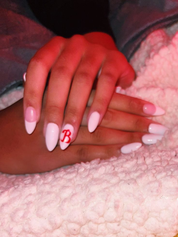 Chic Elegant Nail Design: Glossy White Base with Almond Shape and Vibrant Red Accent