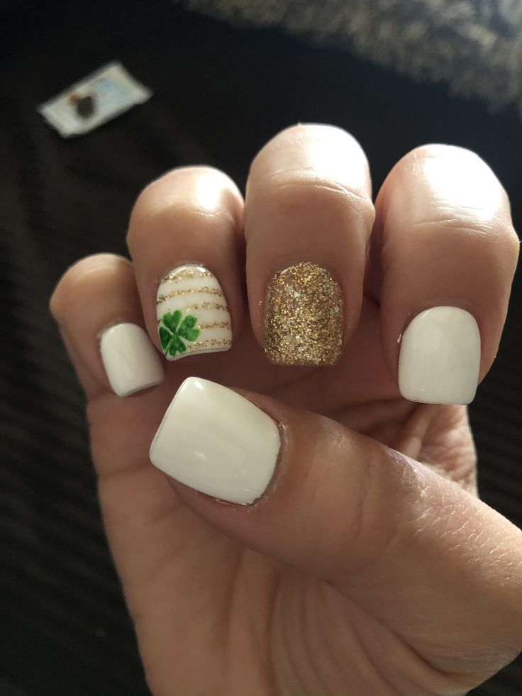 Vibrant Chic Nail Design Featuring White, Gold, and Green Accents for Festive Occasions.