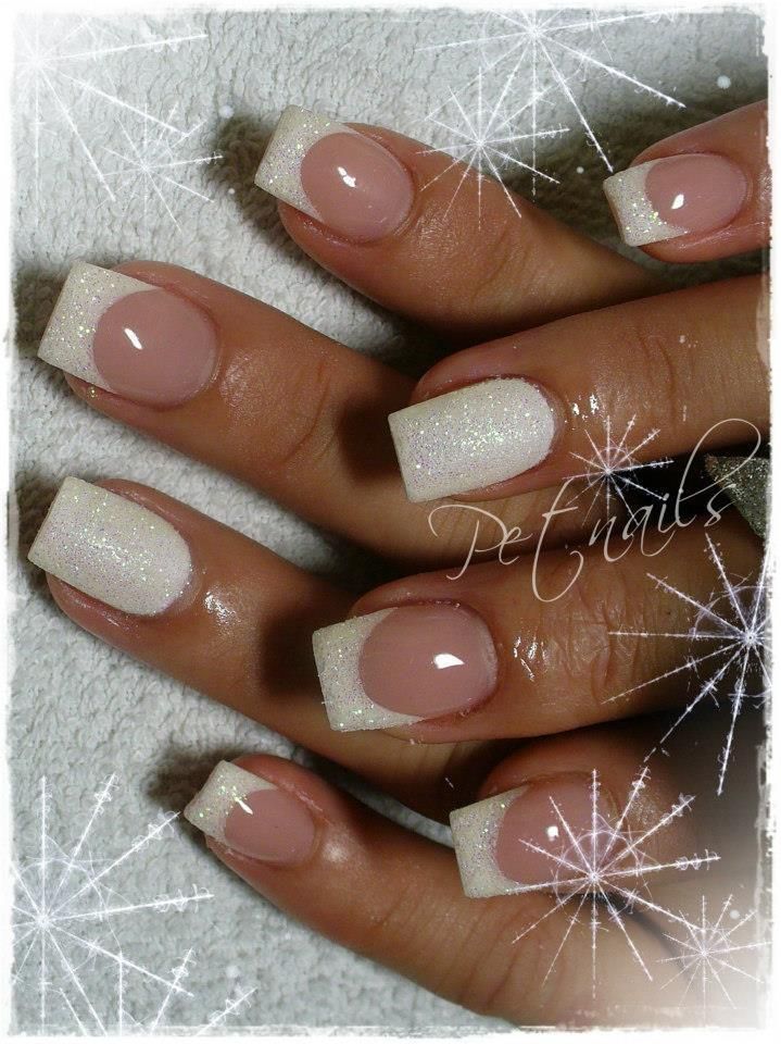 Chic Soft Pink and Shimmering White Tip Nail Design with Glitter Finish.