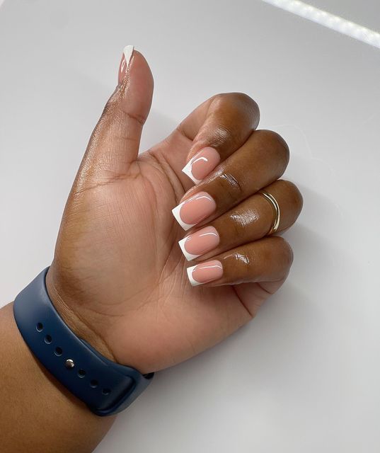 Sophisticated Modern French Manicure with Nude Base and Playful Curves.