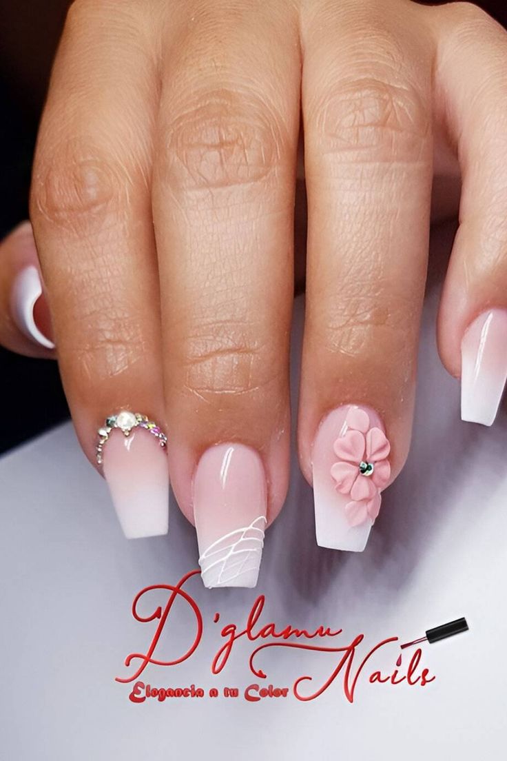 Sophisticated Soft Pink and White Nail Design with Floral and Gem Accents for Special Occasions.