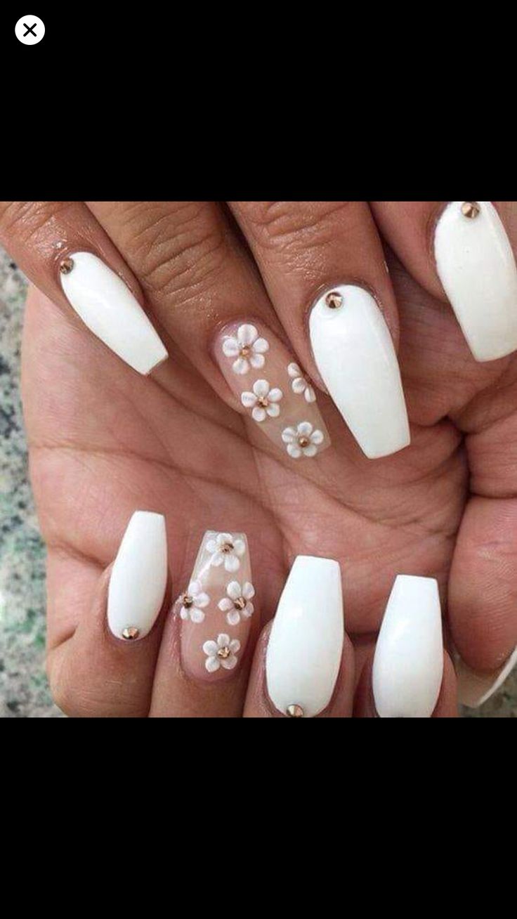 Sophisticated Elegant White Nail Design with Floral Accents and Smooth Finishes.