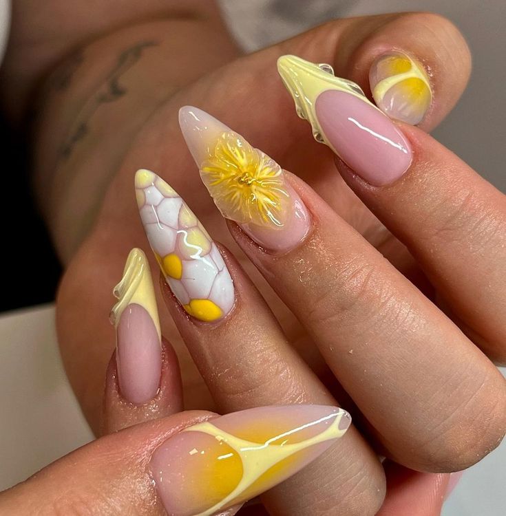 Elegant Pastel Nail Design with Floral Patterns and Swirling Motifs