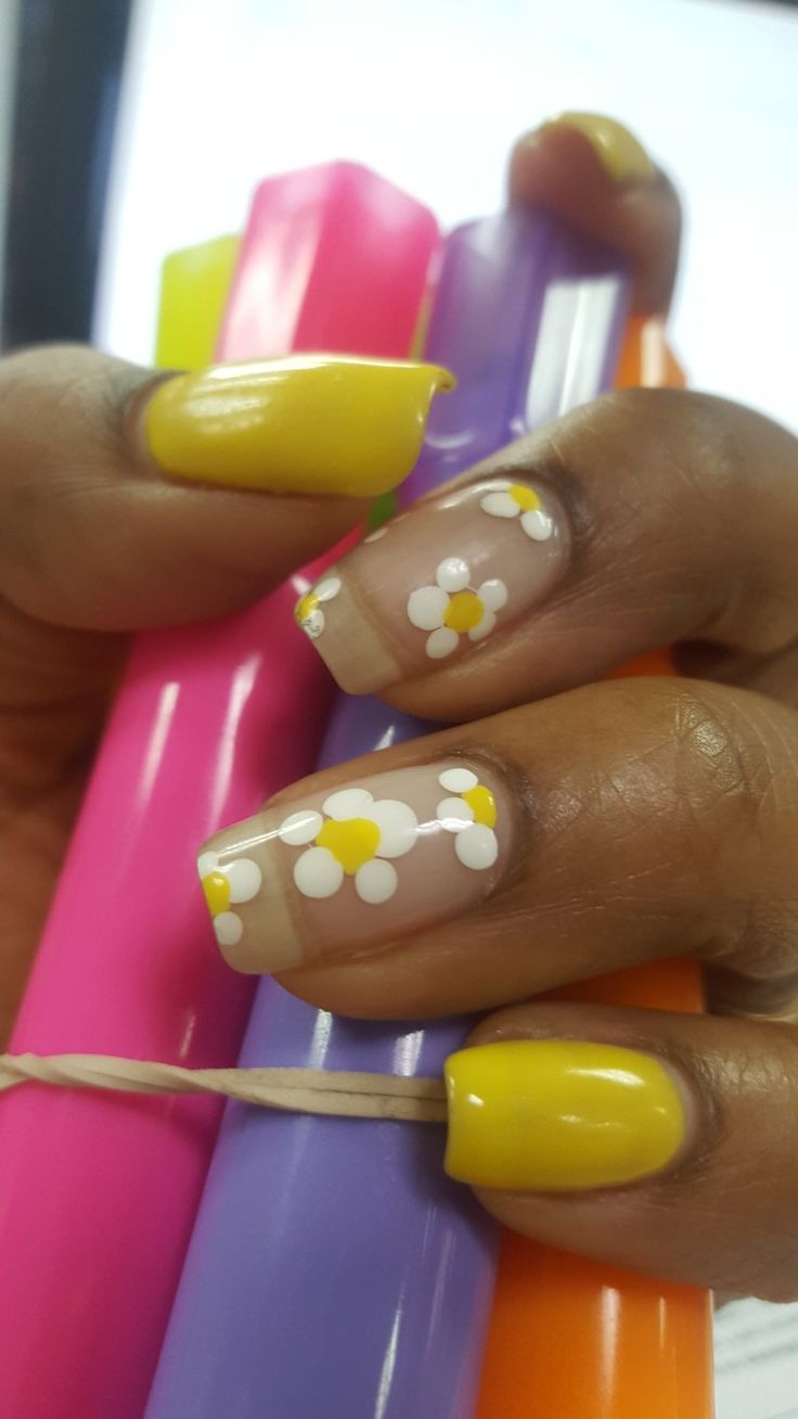 Whimsical Summer Nail Design: Sunny Yellow Polish Meets Floral Elegance