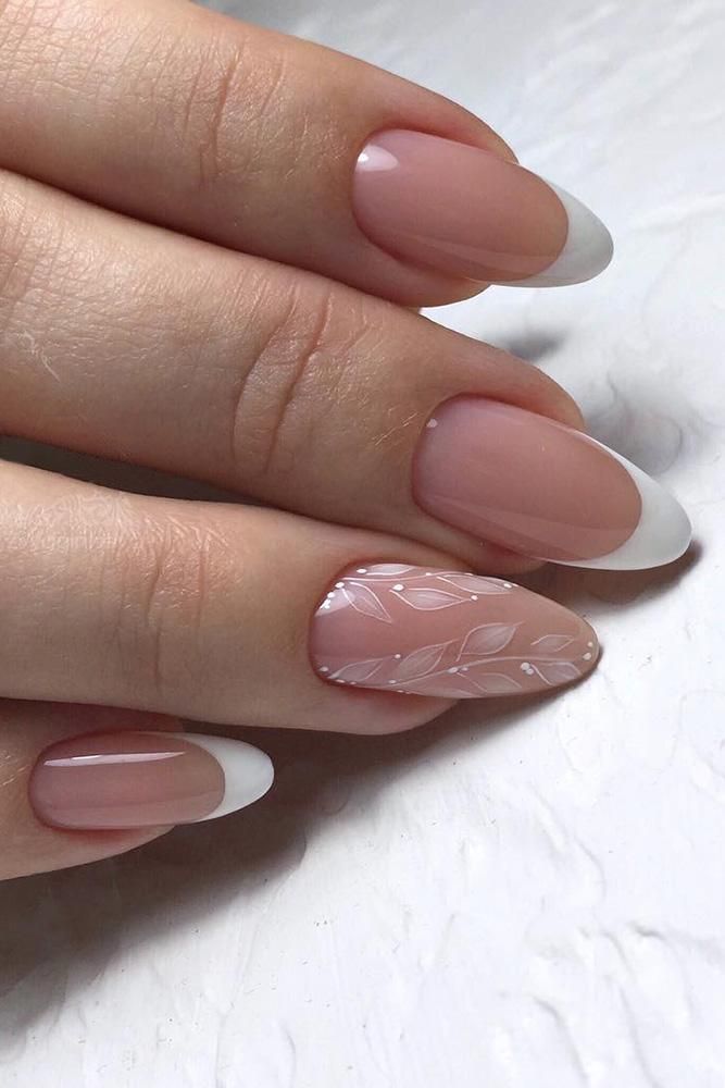 Chic French Tip Manicure with Soft Pink Base, White Tips, and Leaf Accent Detail.