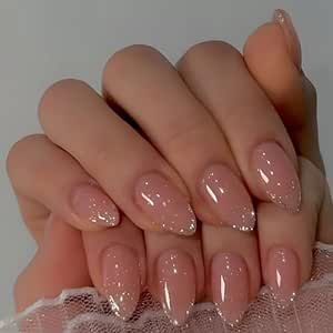 Sophisticated Almond-Shaped Nude Nails with Subtle Sparkle for a Glamorous, Versatile Look.