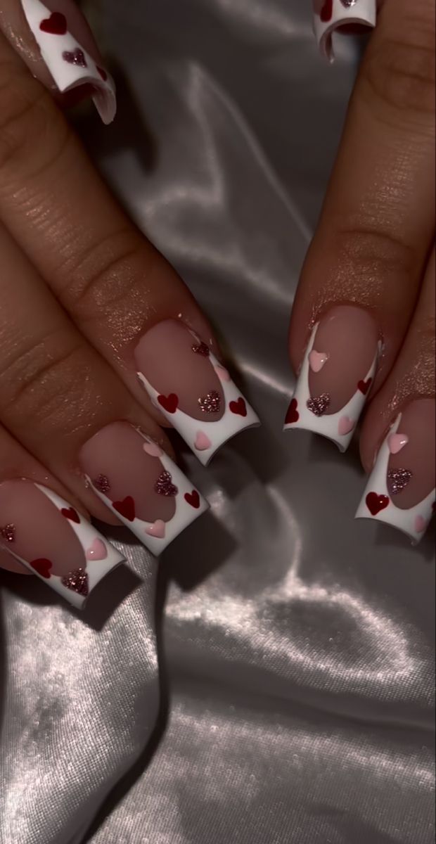 Elegant Heart-Themed Nail Design with Glossy Tips and Glitter Accents