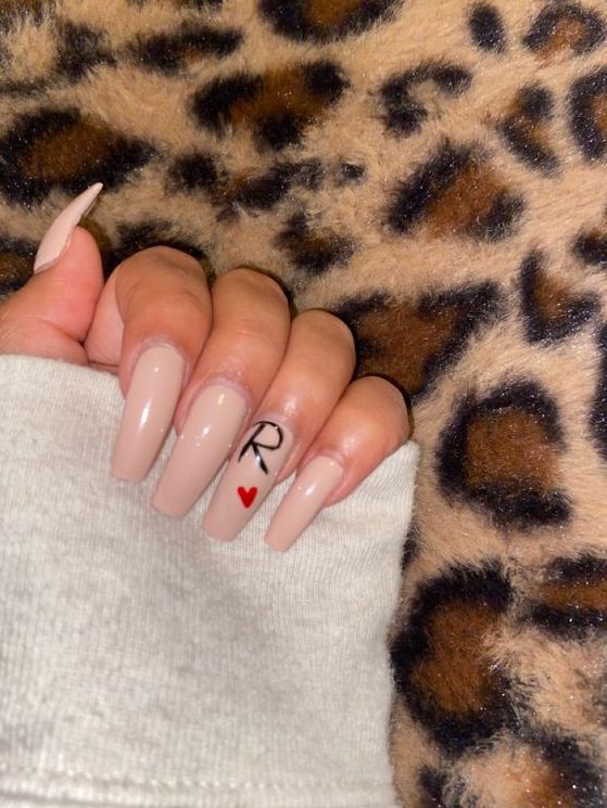 Chic Elegant Nude Nails with Glossy Finish and Personalized Accent Design