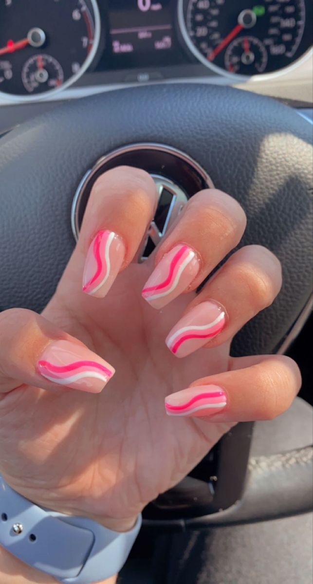 Playful Pink and White Swirl Nail Design: A Creative and Elegant Look for Any Occasion.