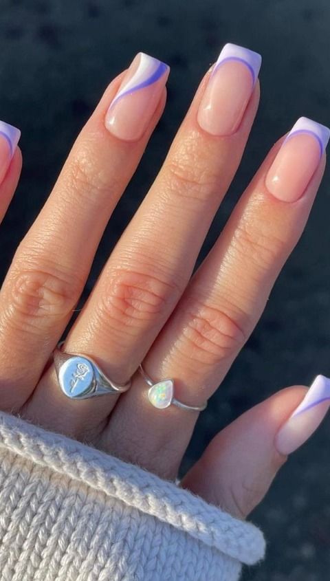 Chic Soft Pink and Pastel Purple Nail Design: Modern Elegance Enhanced with Stylish Rings.