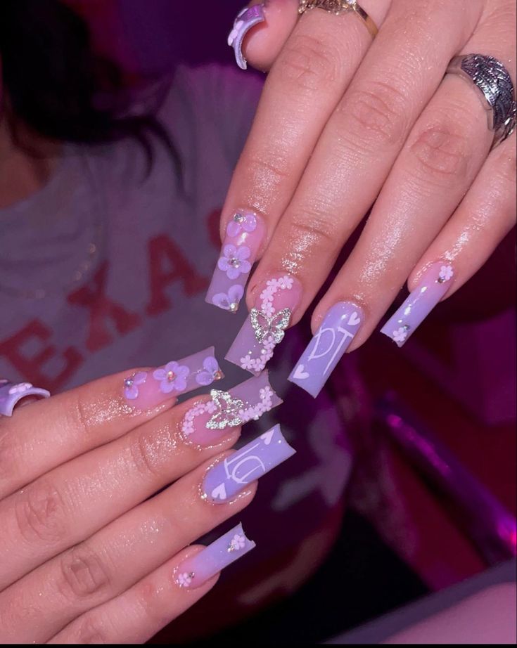 Delicate Lavender Floral Nail Design with Sparkling Accents and Gradient Shades.