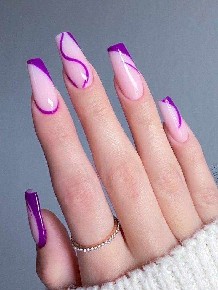 Chic Soft Pink Nails with Bold Purple Accents and Playful Swirls