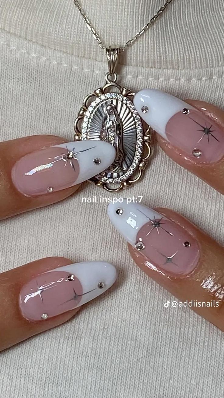 Chic Celestial-Inspired Nail Design: Soft Pink Base with White Tips and Silver Star Accents