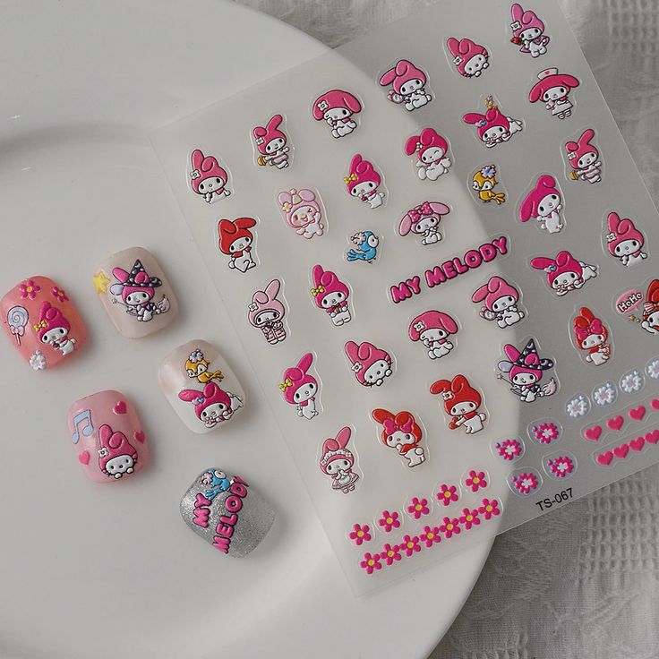 Playful Pink Nail Designs with Whimsical Character Stickers for a Cheerful Aesthetic.