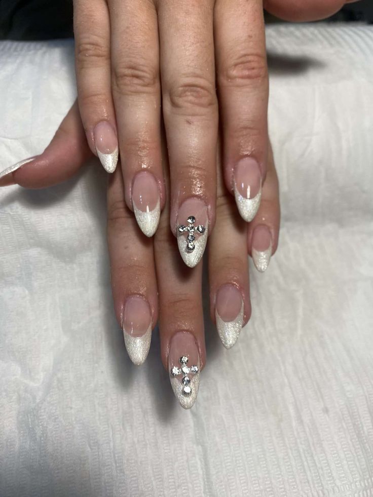 Chic Stiletto Nail Design with Shimmering Gradient and Glamorous Embellishments.