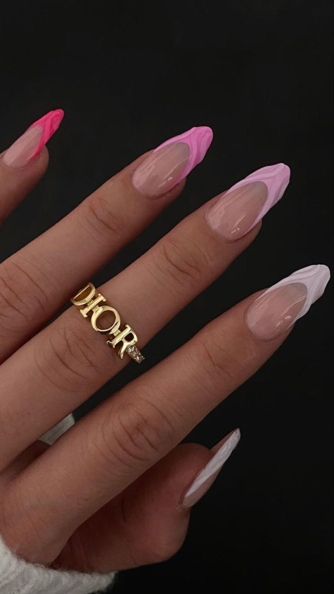 Elegant Vibrant Ombre Nails with Pink and Clear Tones, Enhanced by a Luxe Gold Ring.