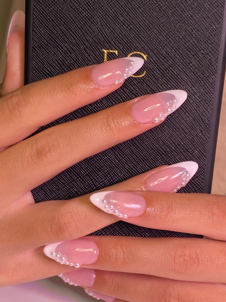 Chic French Manicure: Soft Pink Base, White Tips, and Rhinestone Accents