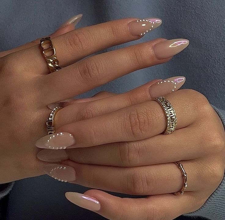 Chic Almond-Shaped Nails with Pearl Accents for Elegant Versatility.