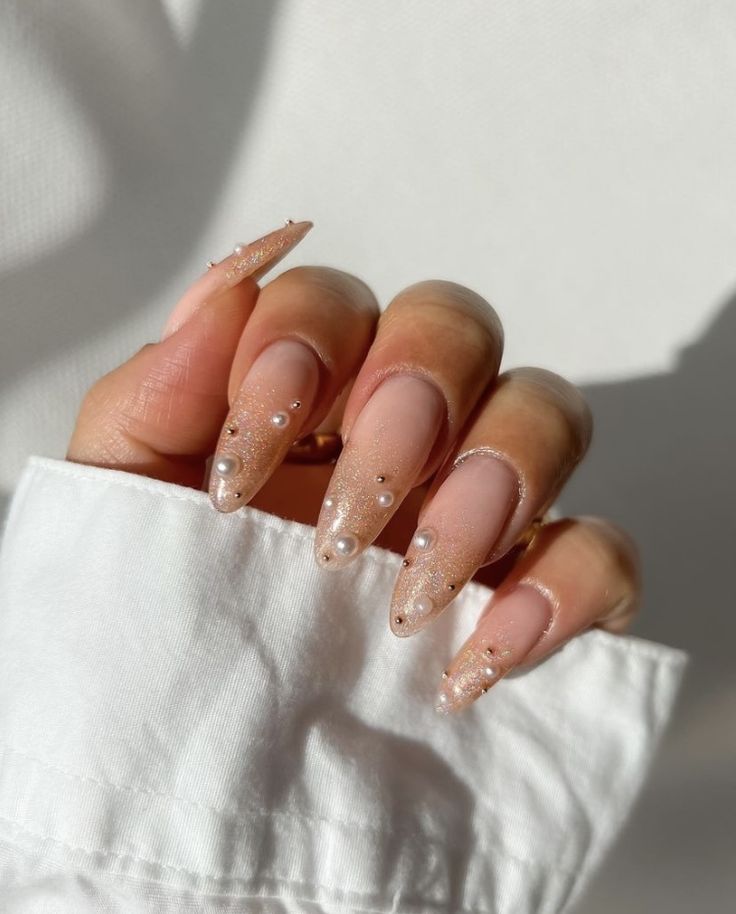 Stylish Almond-Shaped Nails with Nude and Glittery Finishes for Everyday Elegance