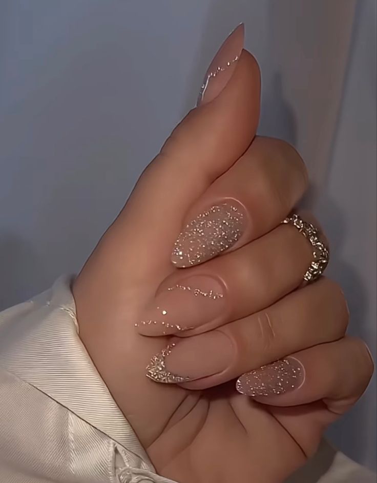 Chic Nude Nail Design with Sparkling Glitter Accents for Any Occasion