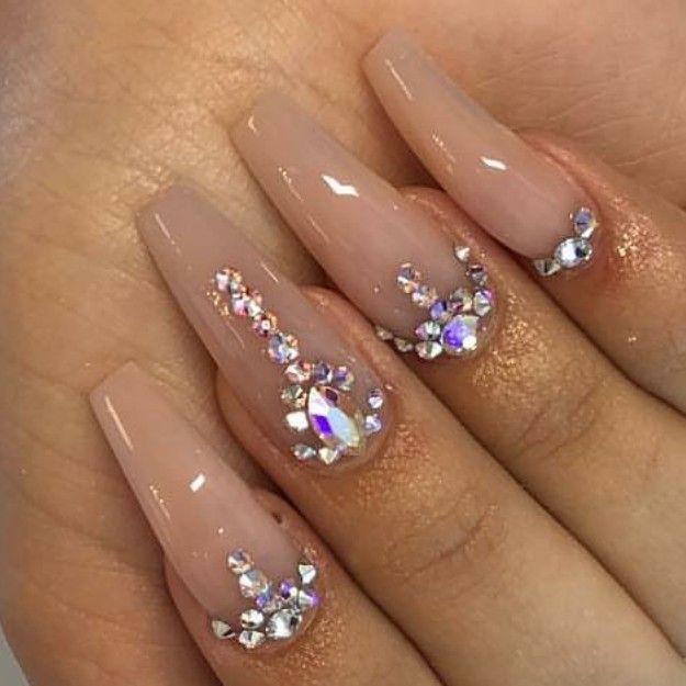 Chic Nude Nail Design with Intricate Rhinestone Patterns for Versatile Glamour.