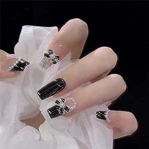 Sophisticated Black Nail Design with Glossy-Matte Finish and Intricate Embellishments.