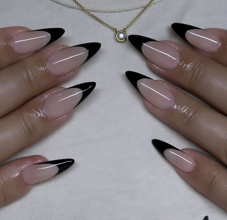 Chic Almond-Shaped Nails with Captivating Nude and Glossy Black Gradient Design.