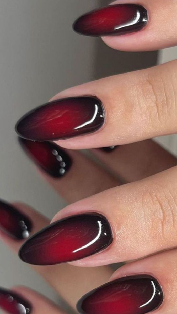 Chic Ombre Nail Design: Bold Deep Red to Black Gradient with Glossy Finish and Elegant Accents.