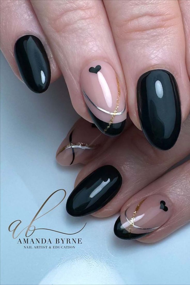 Sophisticated Nail Design: Glossy Black and Nude with Gold Accents