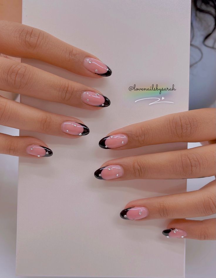 Chic Pink and Black Nail Design with Elegant White Accents