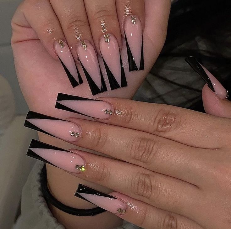 Elegant Geometric Nude and Black Nail Design with Sparkling Accents.