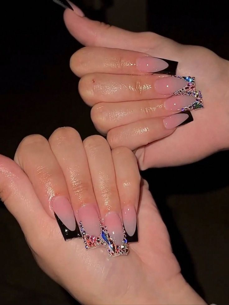 Chic Ombre Nails with Bold Black Tips and Sparkling Rhinestones for a Modern Sophistication.