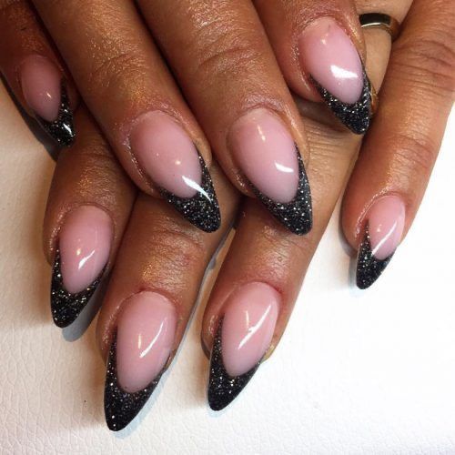 Chic Glossy Pink Stiletto Nails with Bold Black Glitter Tips.