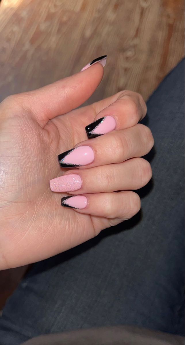 Playful Pink and Bold Black Nail Design: A Chic Blend of Elegance and Edgy Flair.