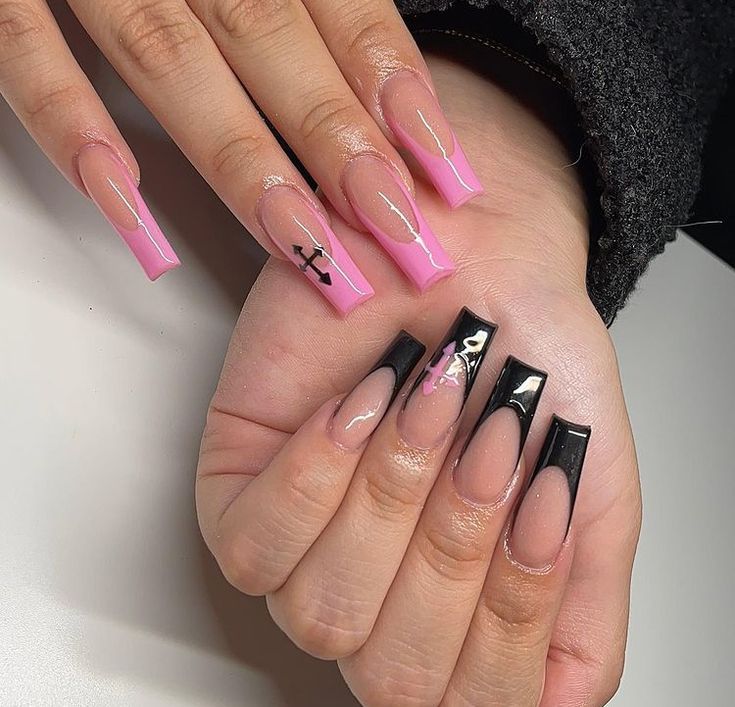 Trendy Pink and Black Bold Nail Design: A Striking Contrast of Playful and Edgy Elements.