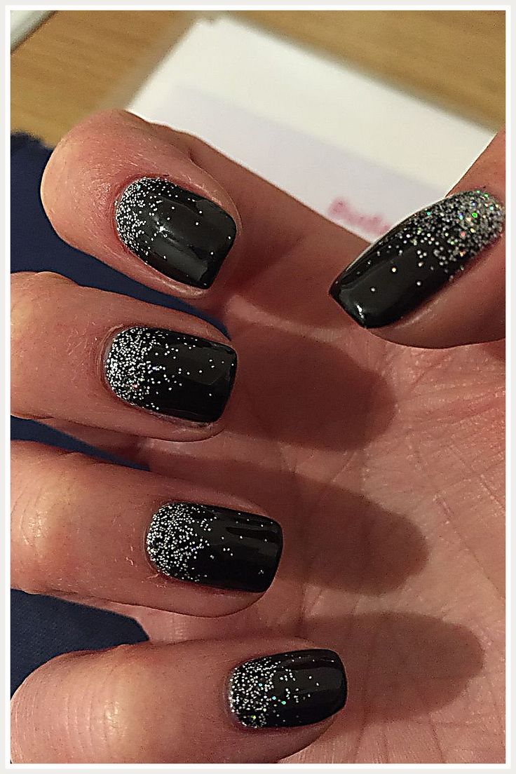 Chic Black Nail Design with Gradient Sparkly Silver Effect for Glamorous Occasions