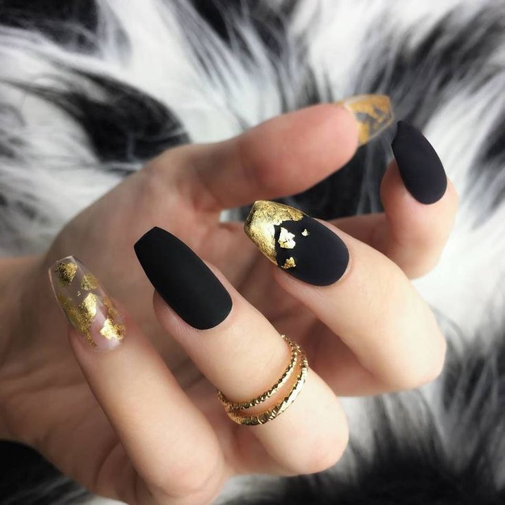 Bold and Sophisticated Matte Black Nail Design with Striking Gold Accents.