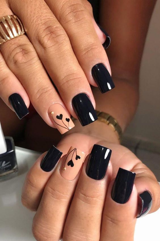 Elegant Chic Nail Design: Striking Black and Nude Contrast with Heart Motifs and Gold Accents