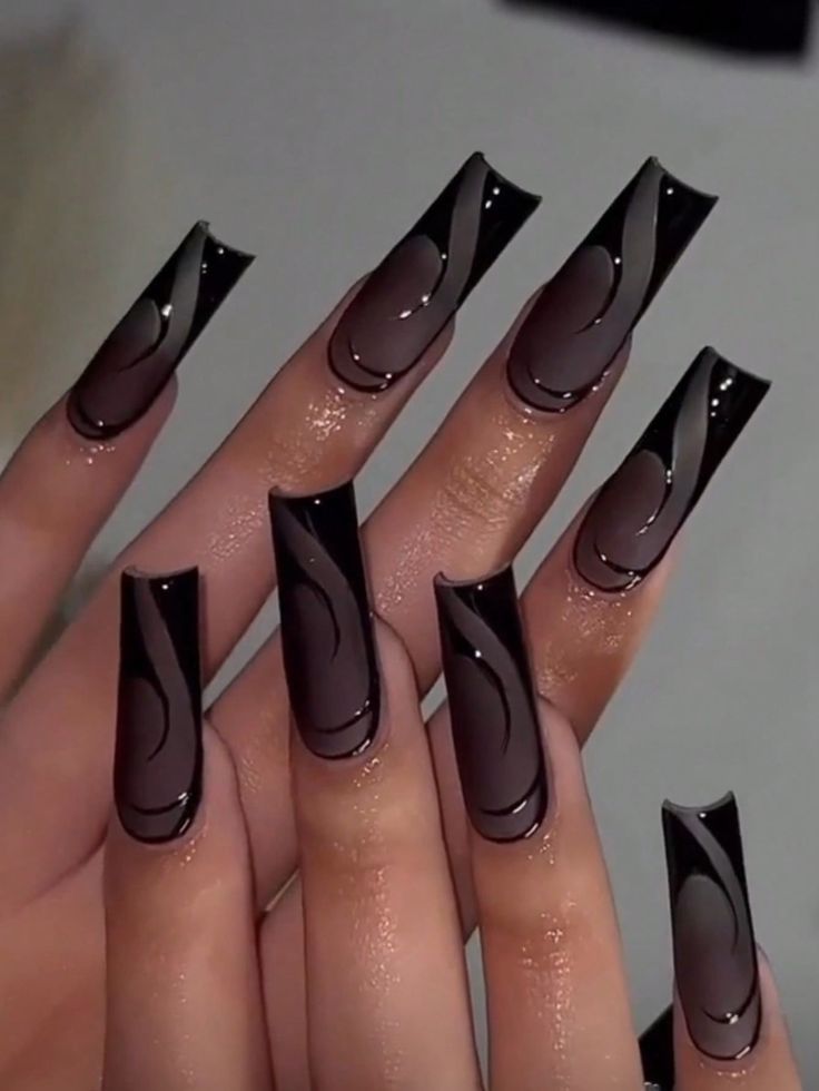 Sophisticated Gradient Nail Design with Long Pointed Shapes in Black and Smoky Hues.