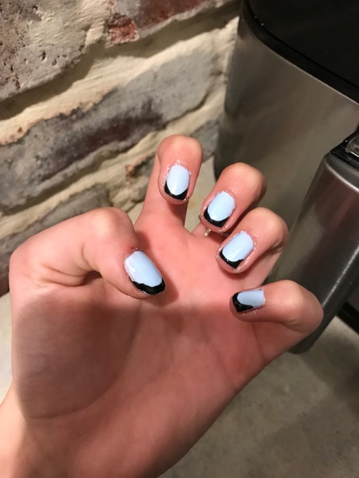 Trendy Pastel Blue Nail Design with Chic Black Outline for Elegant Casual Style.