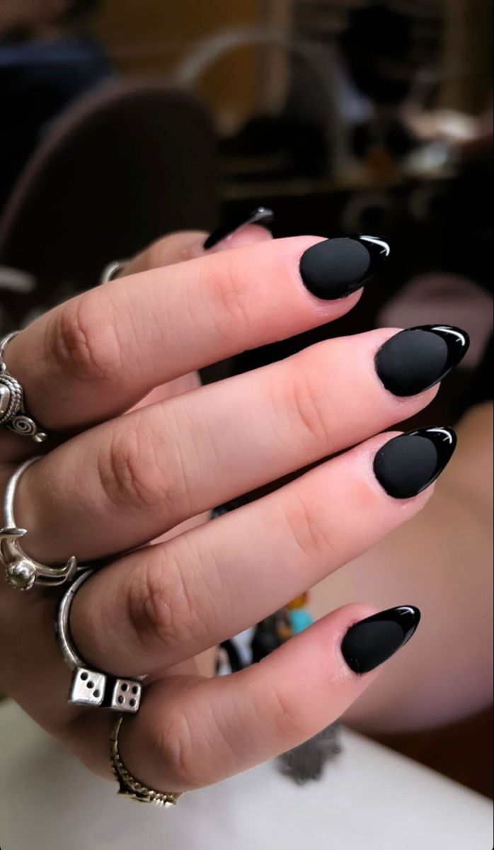 Modern Elegance: Sleek Black Almond-Shaped Nails with Glossy Tips and Matte Finish.