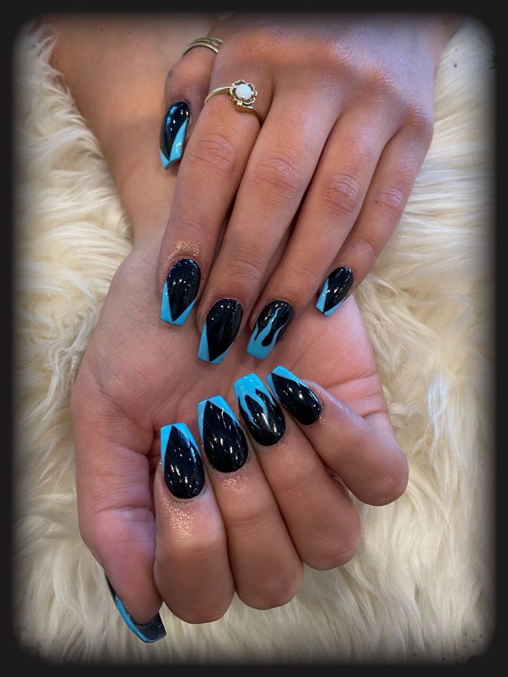 Modern Edgy Nail Design: Bold Black and Vibrant Turquoise with Geometric Patterns and Glitter Accents