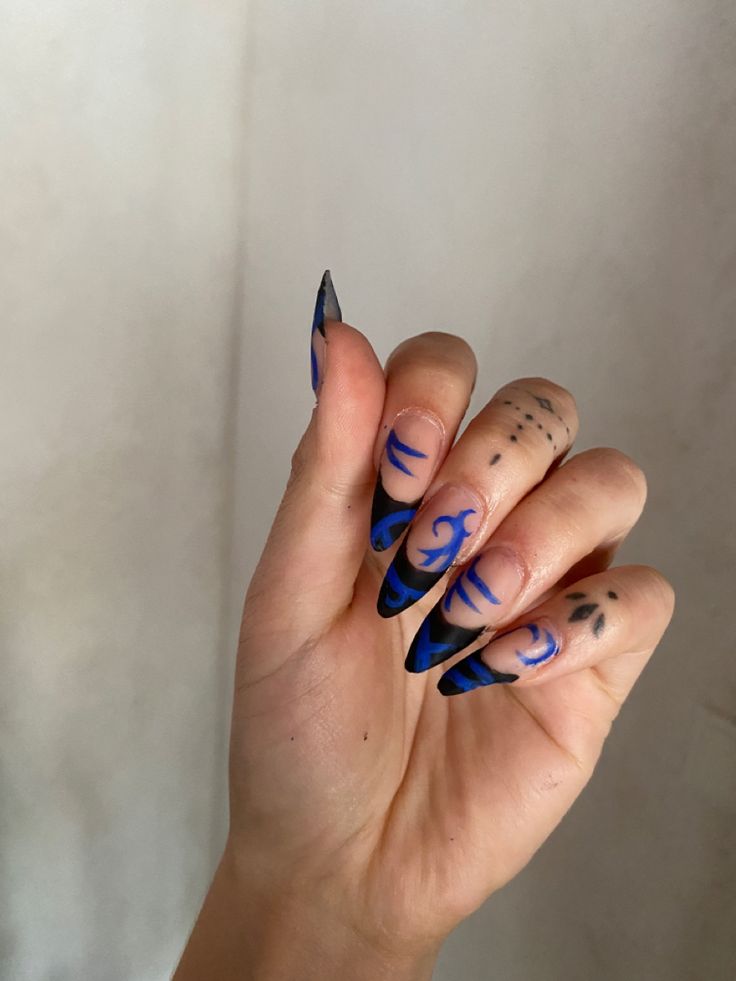 Bold Black and Blue Nail Art Design: Striking Contrast and Creative Flair.