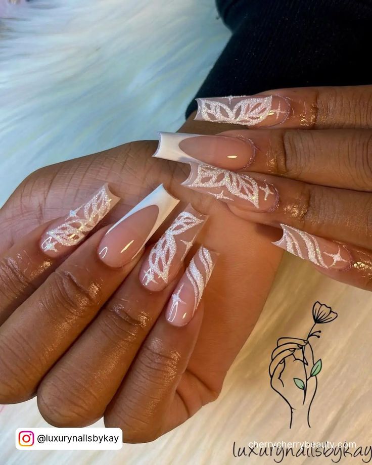 Elegant Nail Design with Glossy and Natural Finishes Featuring Intricate White Leaf Patterns.