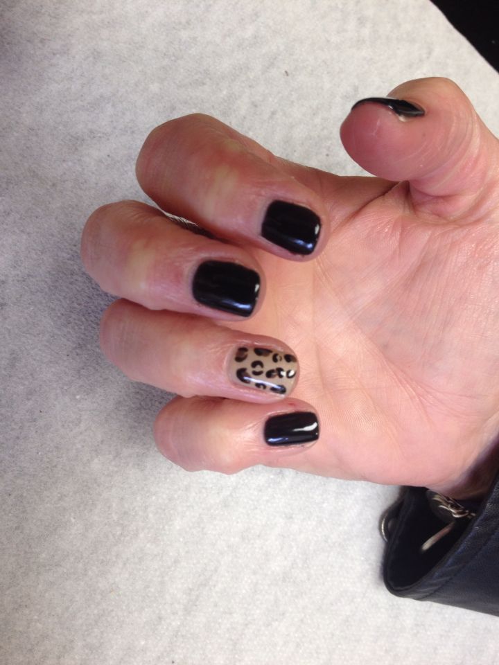 Chic Black Nail Design with Trendy Leopard Print Accent