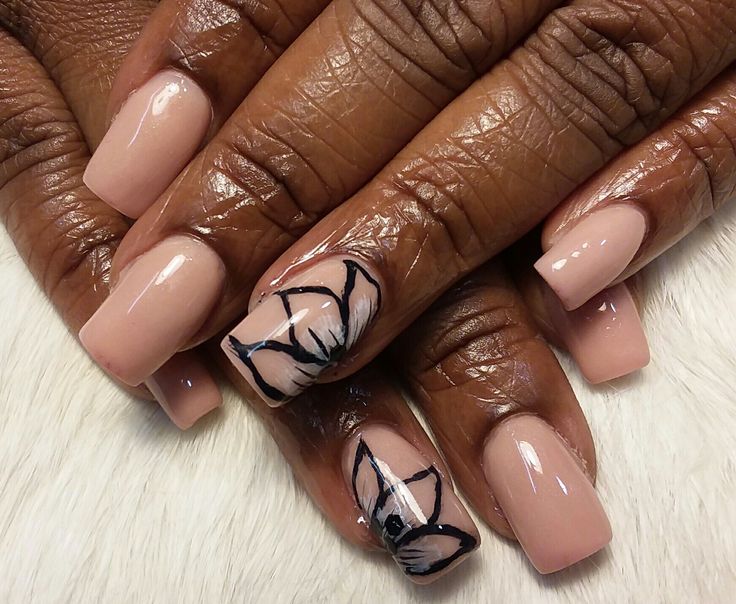 Elegant Nude Nails with Sophisticated Floral Design for Any Occasion.